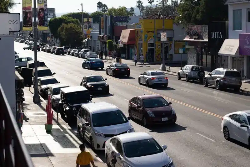 Police, firefighters, and paramedics respond to an injury collision near S Hope Street and Flower Street in Los Angeles.