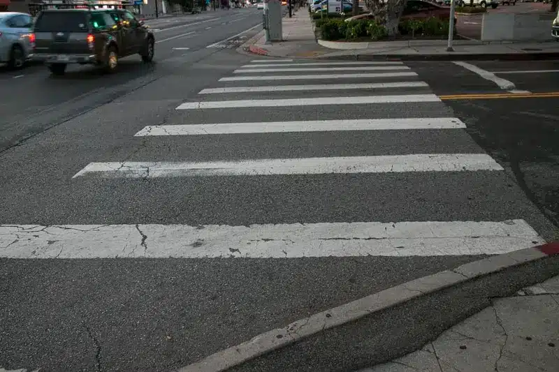 Pedestrian injured in a hit-and-run at S Hoover Street and W Gage Avenue in Los Angeles.