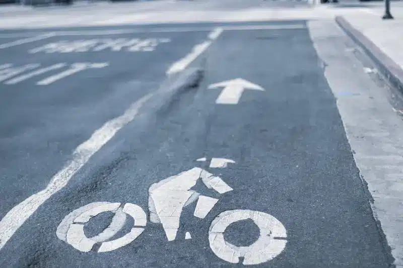 Emergency responders assist an injured bicyclist after a collision at Lankershim Boulevard and Victory Boulevard in Los Angeles.